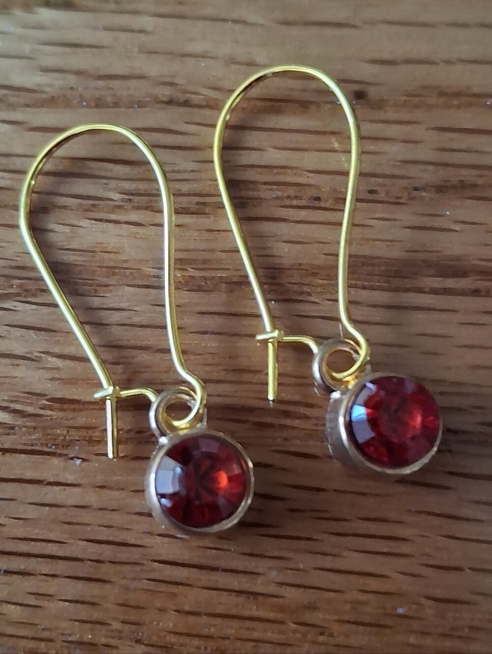 Gold-Tone Drop Earrings with Deep Red Gemstone Accents